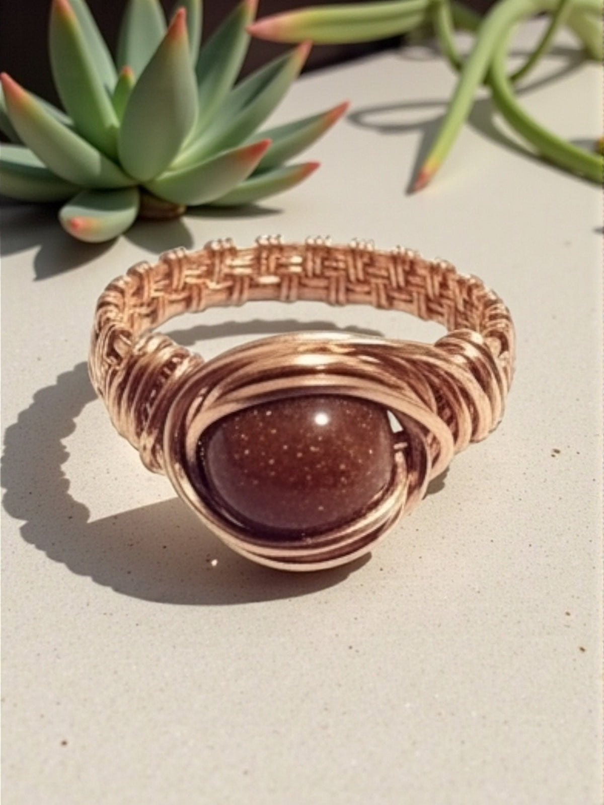 Copper goldstone ring .