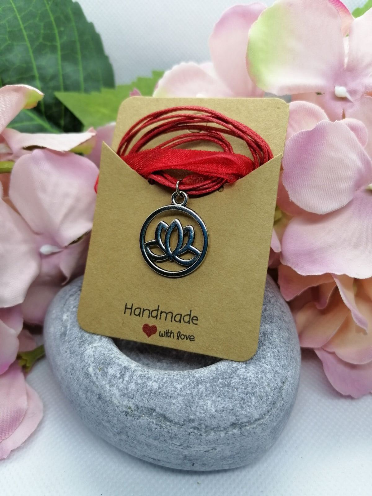 Lotus flower symbol necklace.