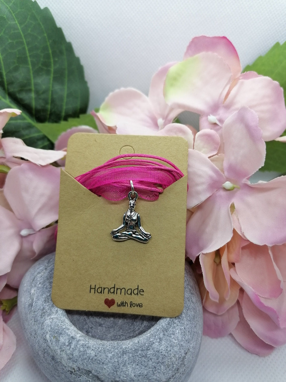 Buddha symbol necklace.