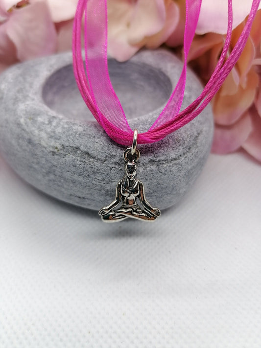 Buddha symbol necklace.