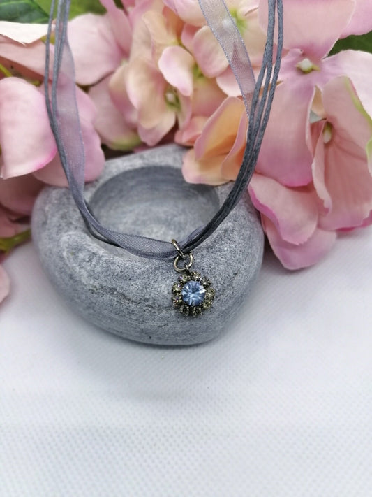Crystal pendant on cord /organza necklace.