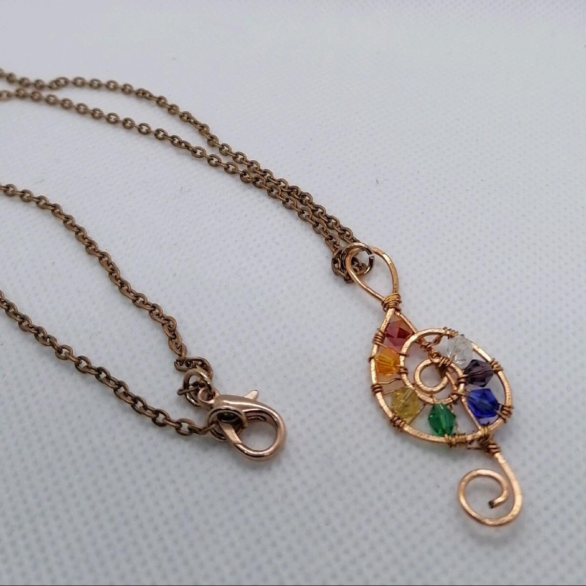 Copper wire wrapped treble clef beaded pendant