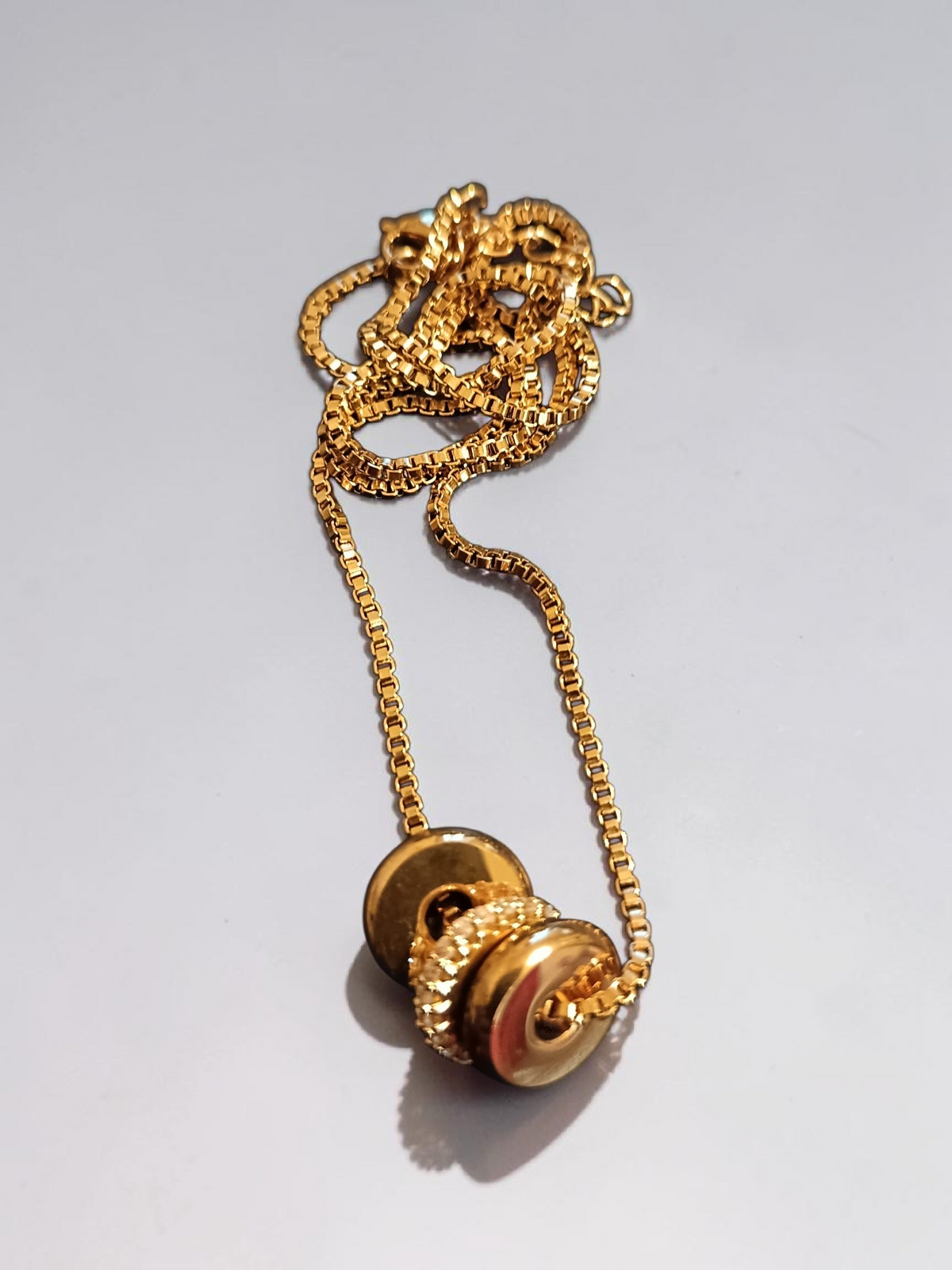 Gold Trilogy necklace.