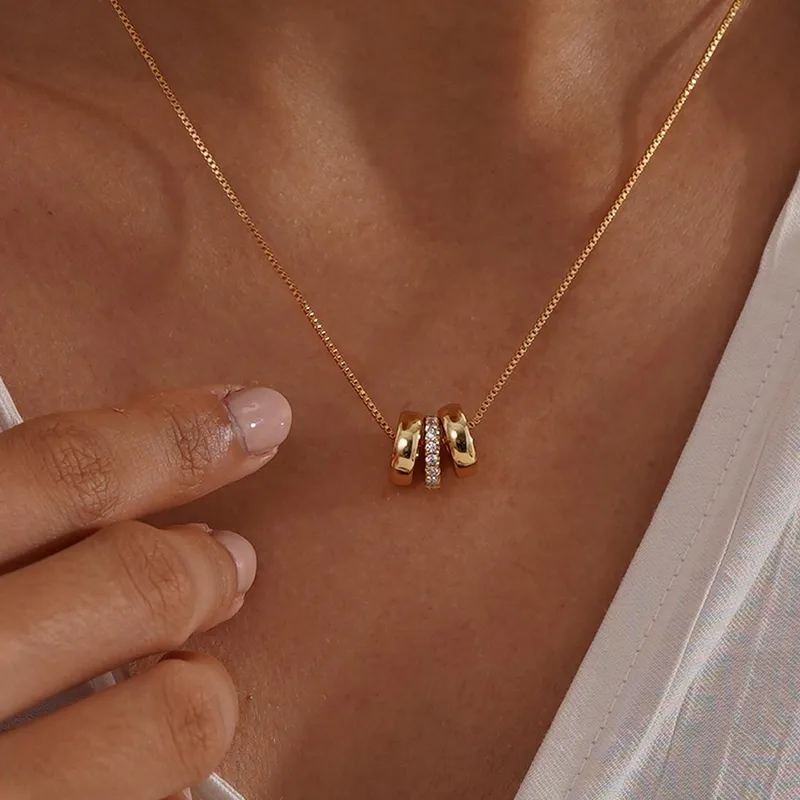 Gold Trilogy necklace.