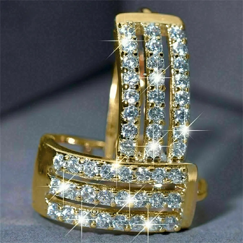 Pair of gold-plated stainless steel hoop earrings with triple rows of cubic zirconia stones