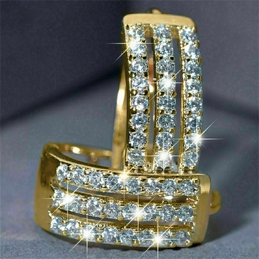 Pair of gold-plated stainless steel hoop earrings with triple rows of cubic zirconia stones