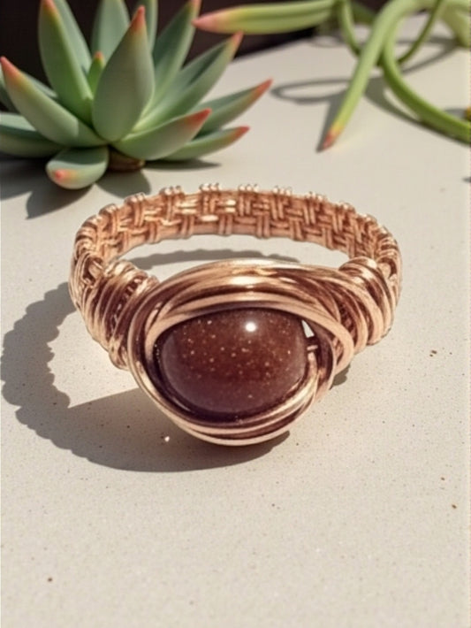 Copper goldstone ring .