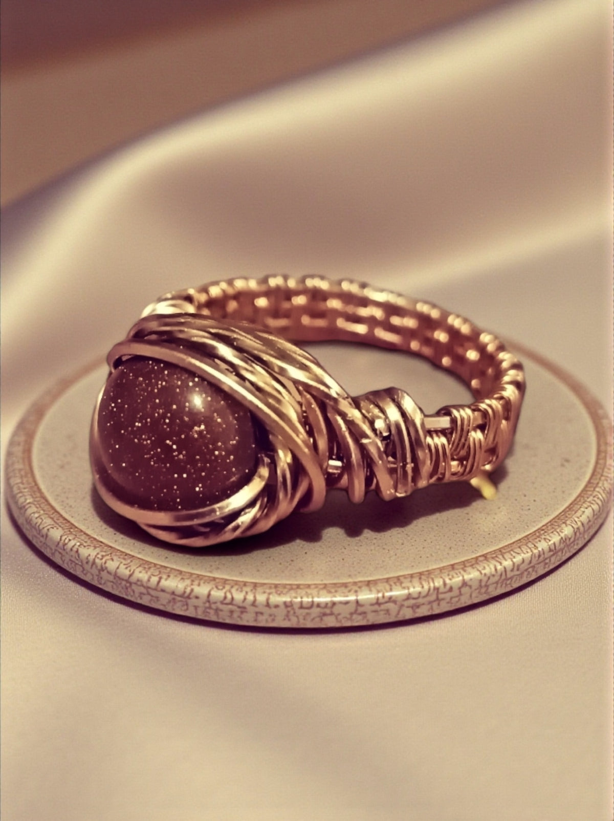 Copper goldstone ring .