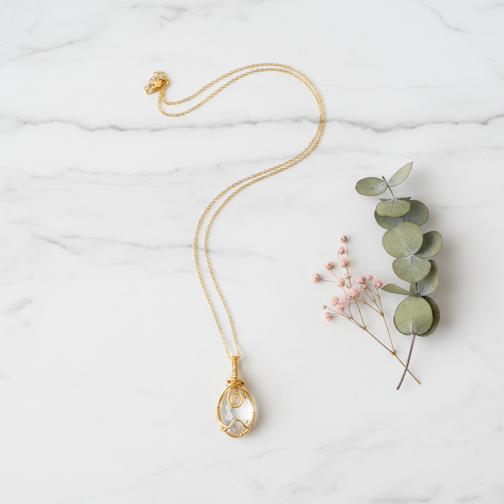 Gold Wire-Wrapped Crystal Pendant Flat Lay