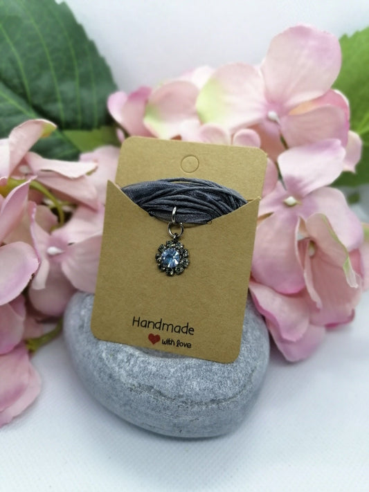 Crystal pendant on cord /organza necklace.