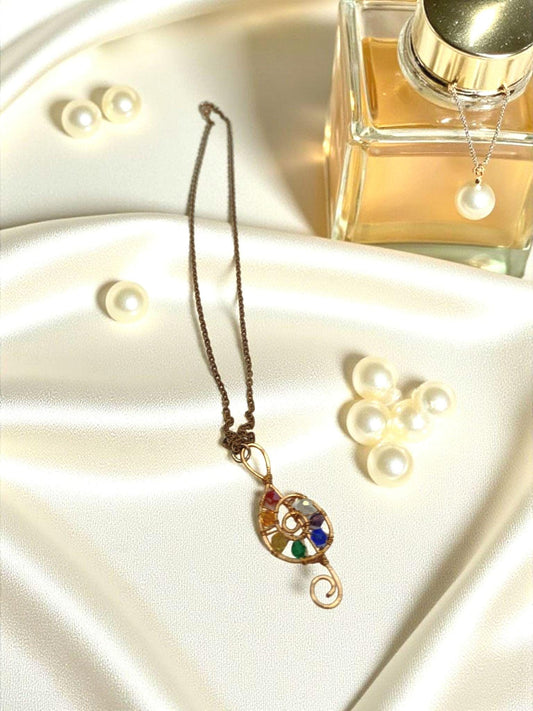 Copper wire wrapped treble clef beaded pendant